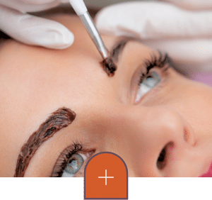 a person holding a tattoo on his head